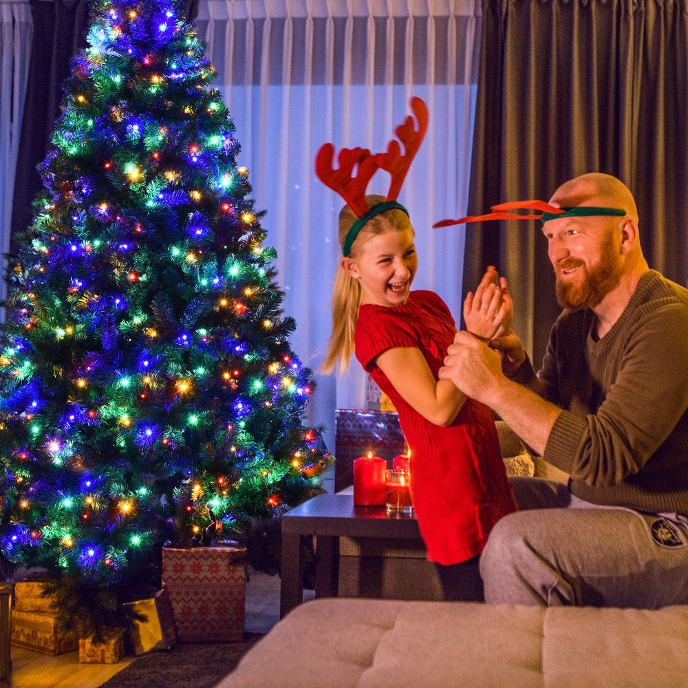 Pre-lit artificial spruce Christmas tree with 550 multicolor lights, designed for easy assembly and perfect for holiday.