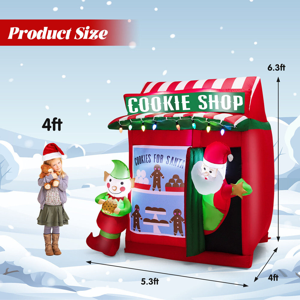 Inflatable gingerbread cookie shop with Santa, showcasing lightweight design and 8 ground stakes for stability in.