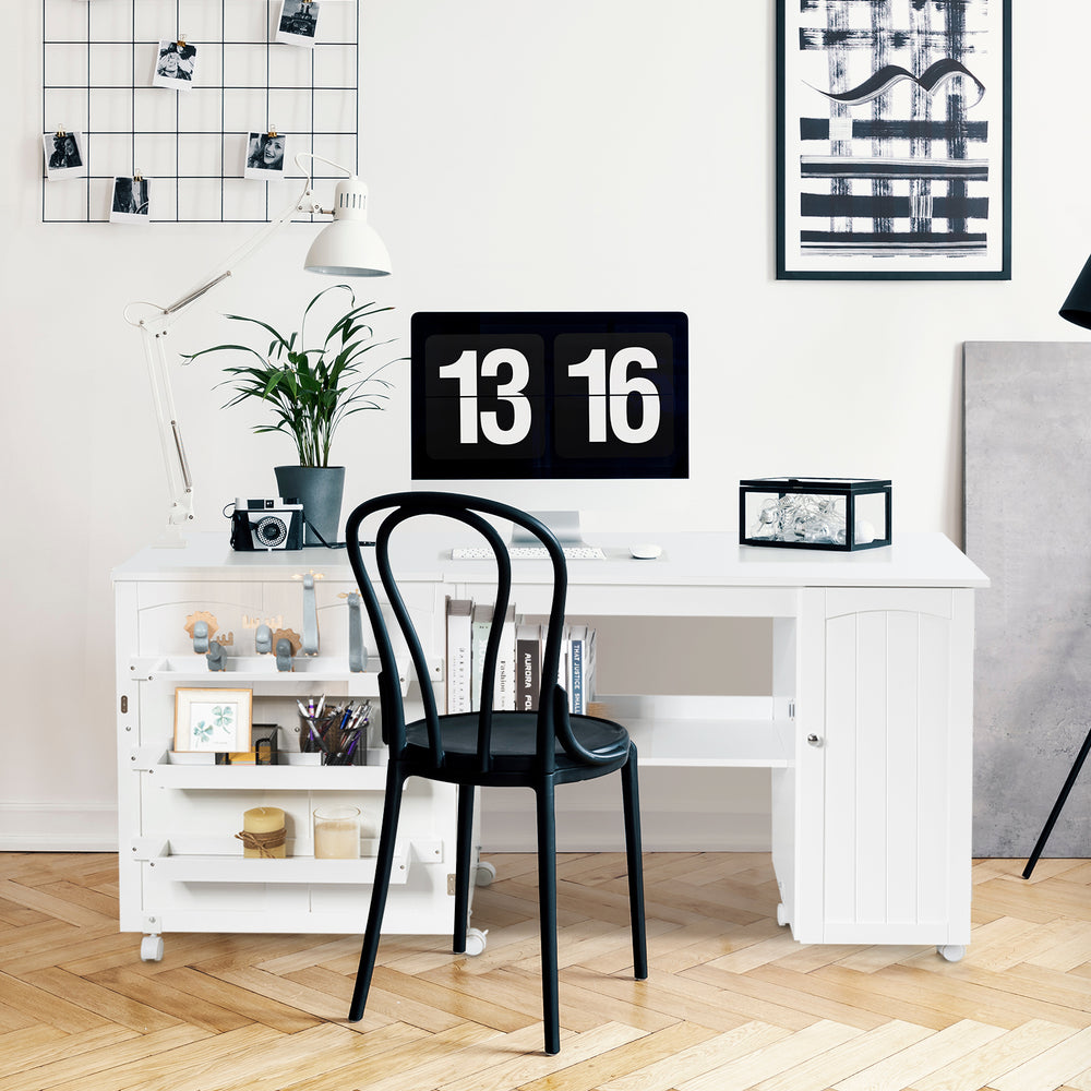 Folding sewing table in white with storage bins and wheels, ideal for crafting or as a computer desk.