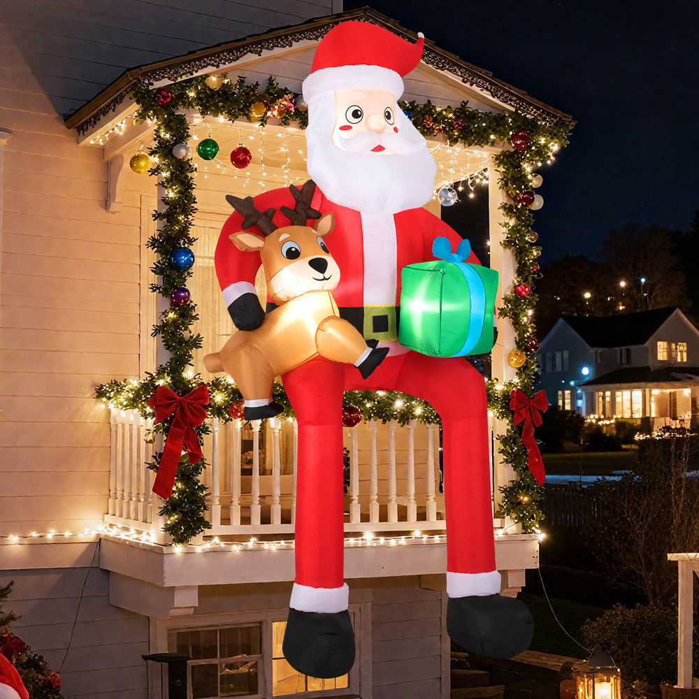 Inflatable 9.5 feet Santa with reindeer and gift box, featuring built-in LED lights for festive outdoor decoration.