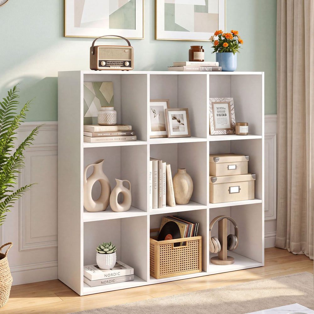 Modern 9-cube bookshelf in white, perfect for organizing books and decor in living rooms or studies.