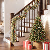 9 FT Christmas Garland with 180 Frosted Branch Tips and 50 Warm White LED Lights draped over a staircase railing.