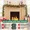 9 ft Christmas garland with frosted branch tips, red berries, and warm white LED lights displayed over a mantel.