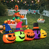 Inflatable pumpkin patch family with witch hats, featuring bright LED lights, perfect for Halloween yard decoration.