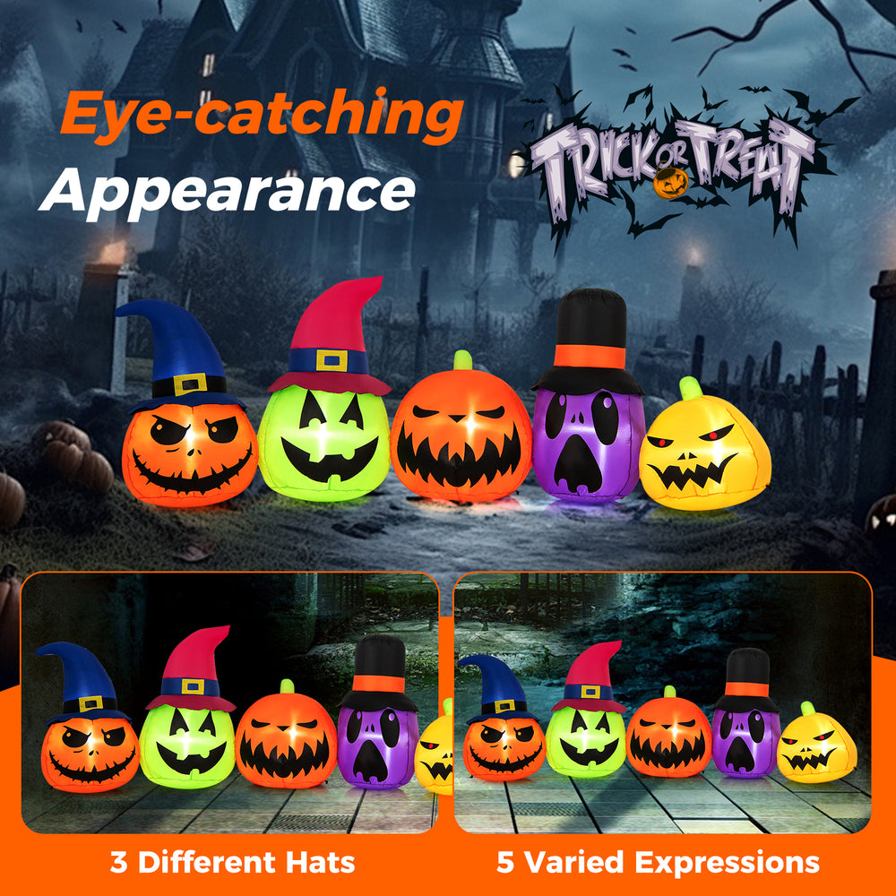 Inflatable pumpkin patch family with witch hats, featuring LED lights and varied expressions for Halloween yard.