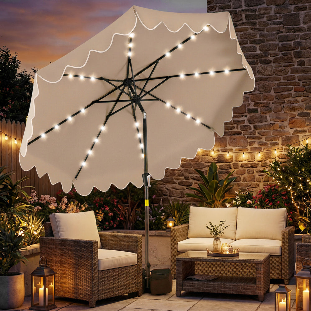 9 FT outdoor patio umbrella with solar LED lights, ruffled edges, and weighted base for stylish shade and illumination.
