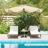 Beige 9 FT patio umbrella with crank handle and push button tilt, ideal for sun protection by the poolside.