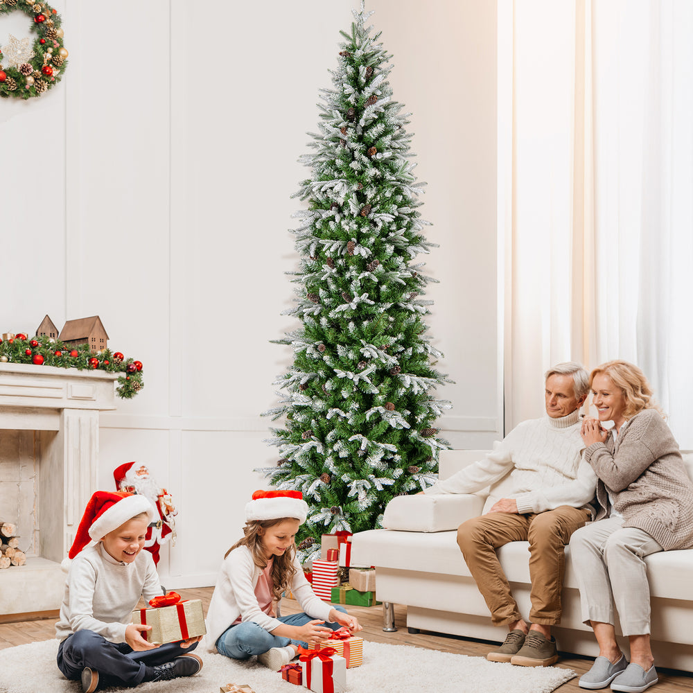 9-foot pre-lit artificial Christmas tree with snow flocking, adorned with pine cones, perfect for festive home.