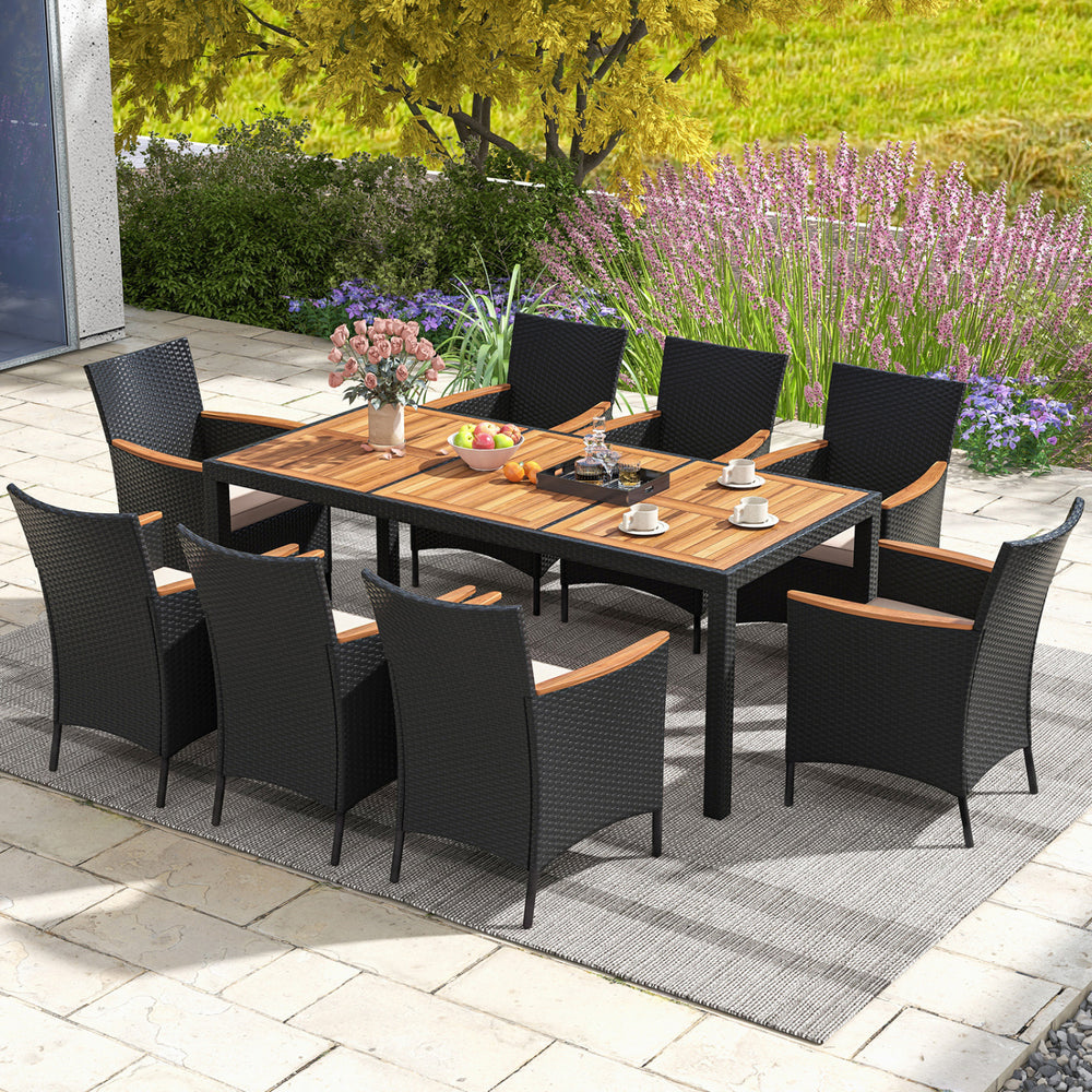 9-piece outdoor dining set featuring a durable acacia wood tabletop and supportive rattan chairs, perfect for patio.