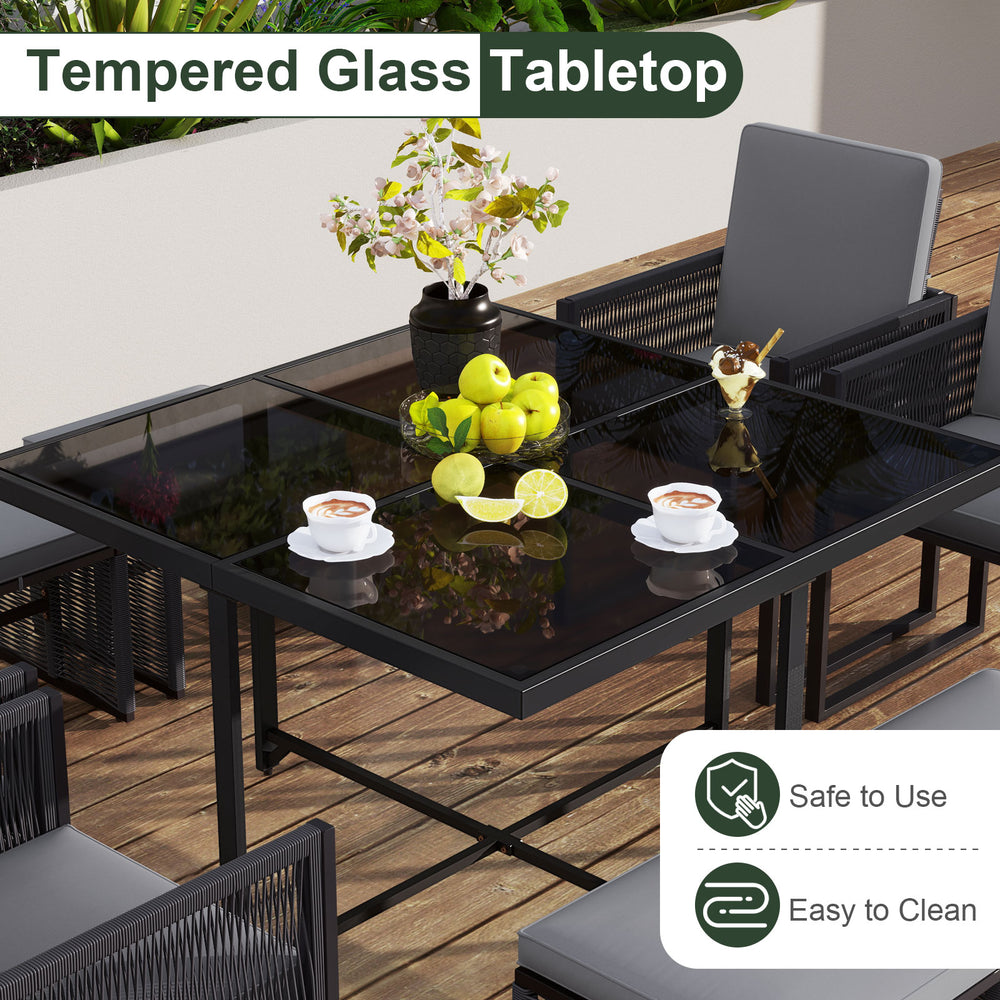 Tempered glass tabletop of a 9-piece patio dining set with gray cushions, ideal for outdoor dining and easy cleaning.