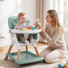 9-in-1 convertible high chair in green with soft cushion, featuring a double tray for eating and playing. Ideal for.