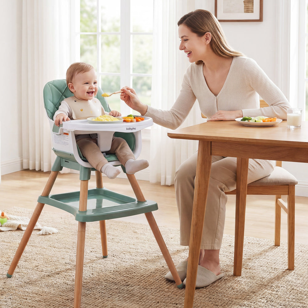 9-in-1 convertible high chair in green with soft cushion, adjustable tray, and solid wood legs for versatile use.
