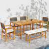 Acacia wood dining table set for 6 with slatted top, ideal for outdoor dining on patios or terraces.