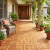 Acacia wood interlocking deck tiles arranged on a porch, ideal for outdoor patios and balconies with natural beauty.