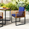Acacia wood outdoor dining chair with navy soft cushion, featuring a sturdy metal frame and rustic charm for patio use.