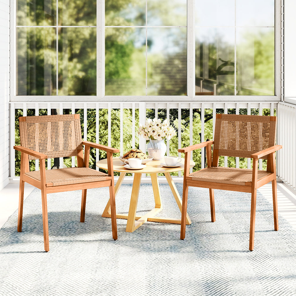 Set of 2 acacia wood outdoor dining chairs with PE rattan, featuring backrests and armrests, ideal for patio use.
