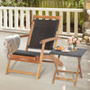 Folding lounge chair with retractable ottoman and acacia wood table, featuring brown PE wicker for patio relaxation.