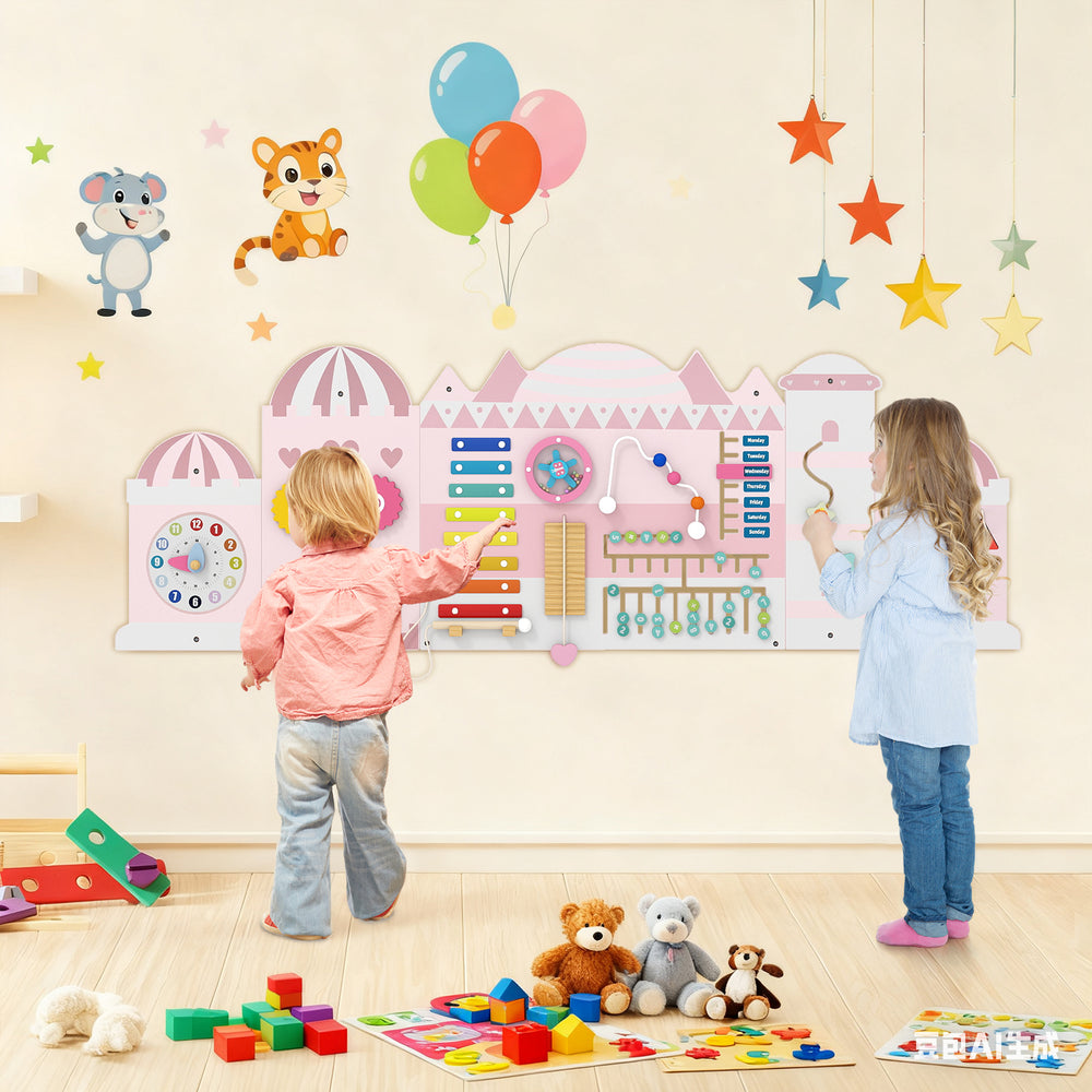 Wooden pink activity wall busy board for toddlers featuring xylophone, clock, and abacus for sensory play and learning.