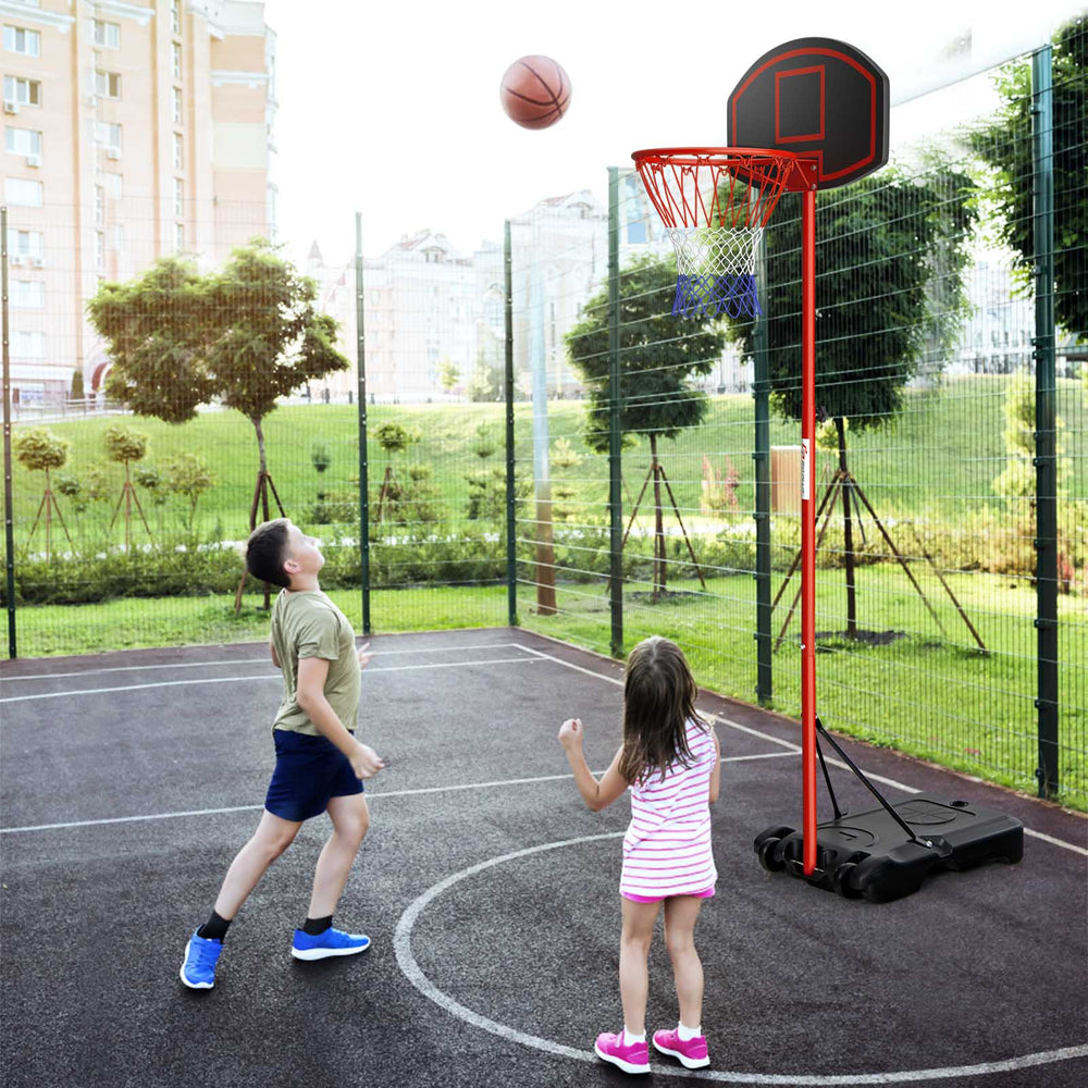 Children playing basketball with an adjustable hoop in black and red, showcasing its portable design and adjustable.