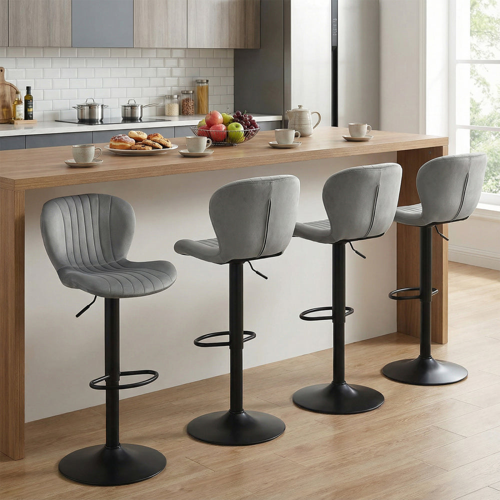 Adjustable gray velvet counter height chairs with 360° swivel and round metal base, ideal for home bars and dining.