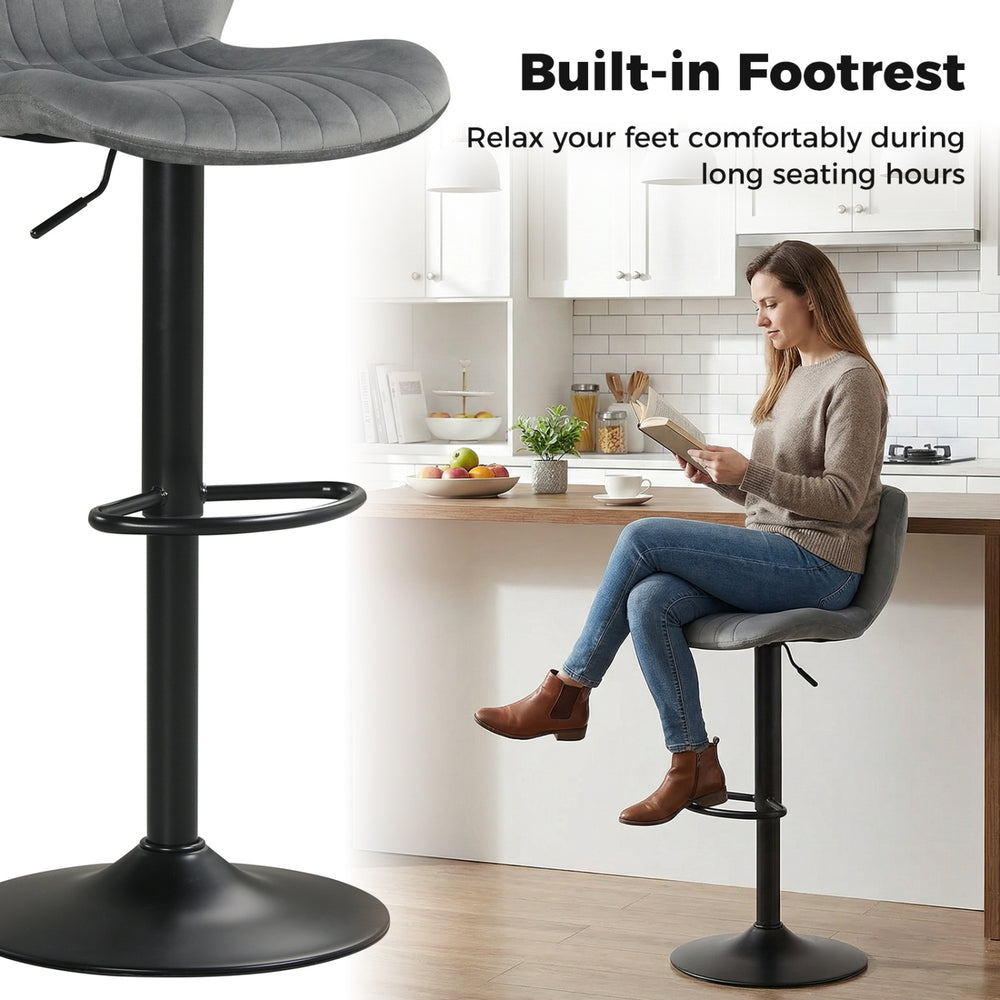 Adjustable gray counter height chair with velvet upholstery and built-in footrest, ideal for home bars and dining rooms.