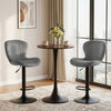 Adjustable gray velvet counter height chairs with 360° swivel and round metal base, ideal for home bars or dining rooms.