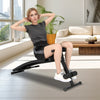 Adjustable decline sit-up bench with padded cushion, suitable for various exercises, shown in a modern living space.