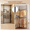 Adjustable floor-to-ceiling clothes rack in black with 4 hanging rods, perfect for maximizing closet space and organization.