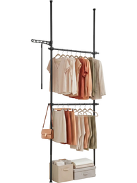 Adjustable black floor-to-ceiling clothes rack with two hanging rods, ideal for maximizing closet space and organization.