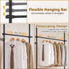 Adjustable floor-to-ceiling clothes rack in black with telescoping design and two sturdy hanging rods for versatile storage.