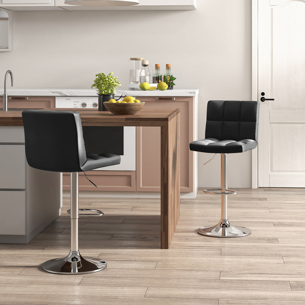 Adjustable swivel bar stool in black PU leather with cushioned seat and chrome base, ideal for kitchen or dining areas.
