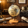 Mini rotating antique globe with wooden base, featuring clear geographic details, perfect for education or decoration.