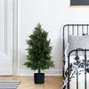 Artificial cedar topiary tree in a plastic nursery pot, perfect for office or porch decor with realistic leaves.