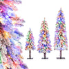 Set of 3 artificial Christmas trees with snow-flocked branches and multi-color LED lights for festive indoor decoration.