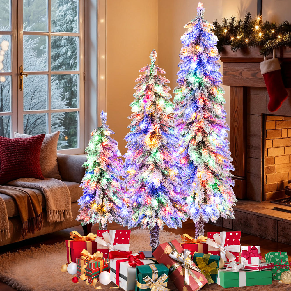Artificial Christmas tree set of 3 with snow-flocked branches and multi-color LED lights, perfect for festive indoor.