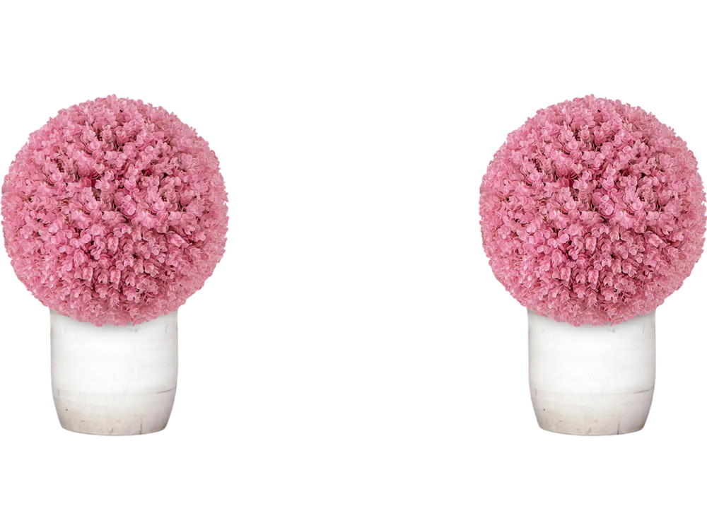 Faux pink eucalyptus decorative balls in white pots, perfect for enhancing garden or porch aesthetics.