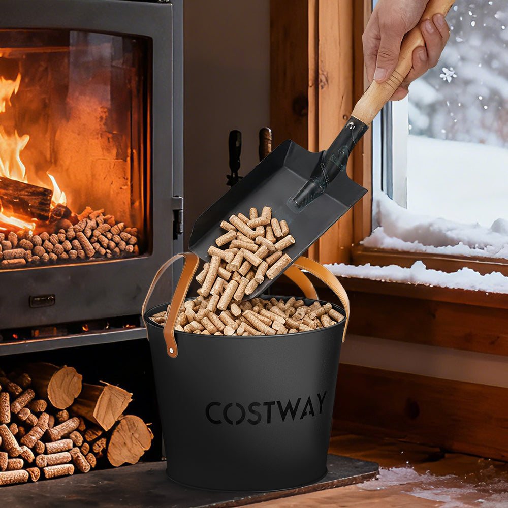 Black metal ash bucket with leather handles, perfect for storing ash and pellets by the fireplace.