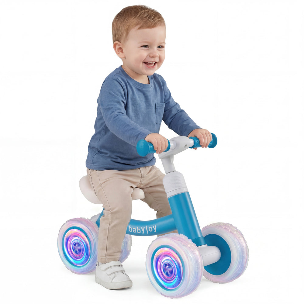 Baby balance bike in blue with glowing wheels, adjustable seat and handlebars, perfect for indoor and outdoor fun.