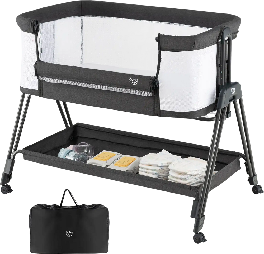 Portable bedside sleeper for baby in black with 7 adjustable heights, mesh sides, and bottom storage for essentials.