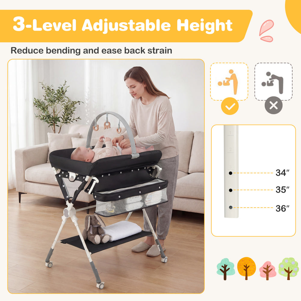 Foldable black baby changing table with 3-level adjustable height, storage bag, and side drying rack for easy diaper.