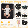 Foldable baby changing table in black with detachable cover, storage bag, and adjustable height for convenience.