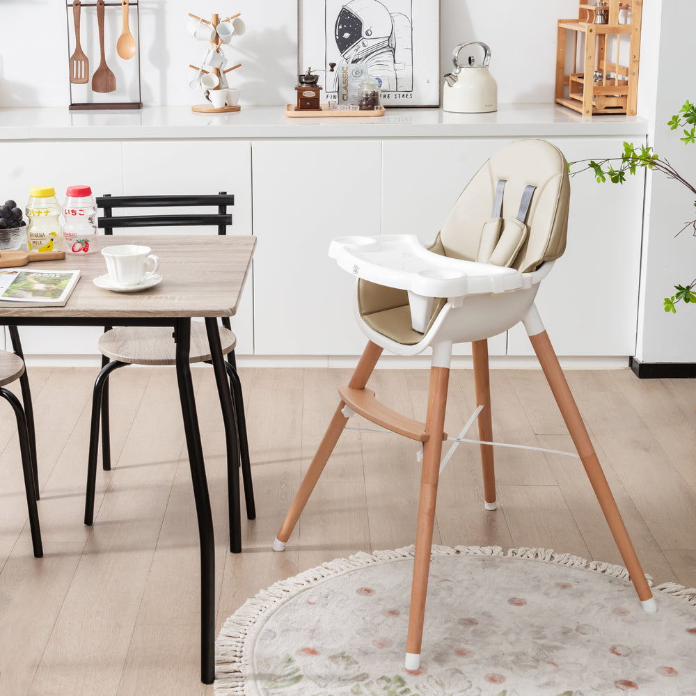 Baby high chair in beige with solid beech wood legs, 5-point harness, and dishwasher-safe tray for convenient feeding.