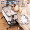 Gray baby bassinet bedside sleeper showing breathable mesh on all sides for visibility and comfort during co-sleeping.