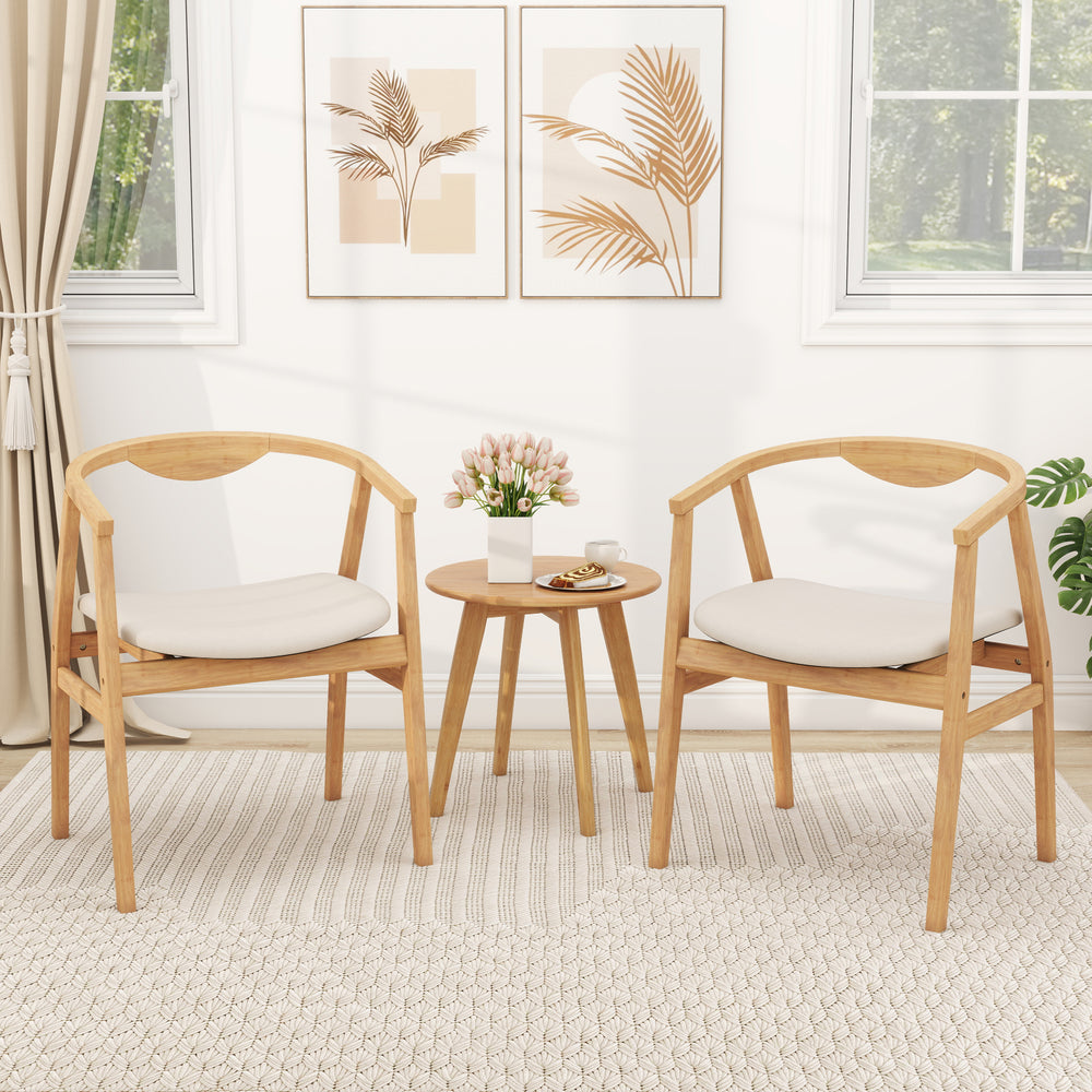 Bamboo accent chairs with armrests and curved backrests, featuring soft cushions, perfect for living room decor.