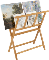 Bamboo art print rack with X-shaped support holds canvases up to 34