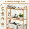 3-tier bamboo bathroom organizer with adjustable shelves, hooks, and slatted design for towels and toiletries storage.