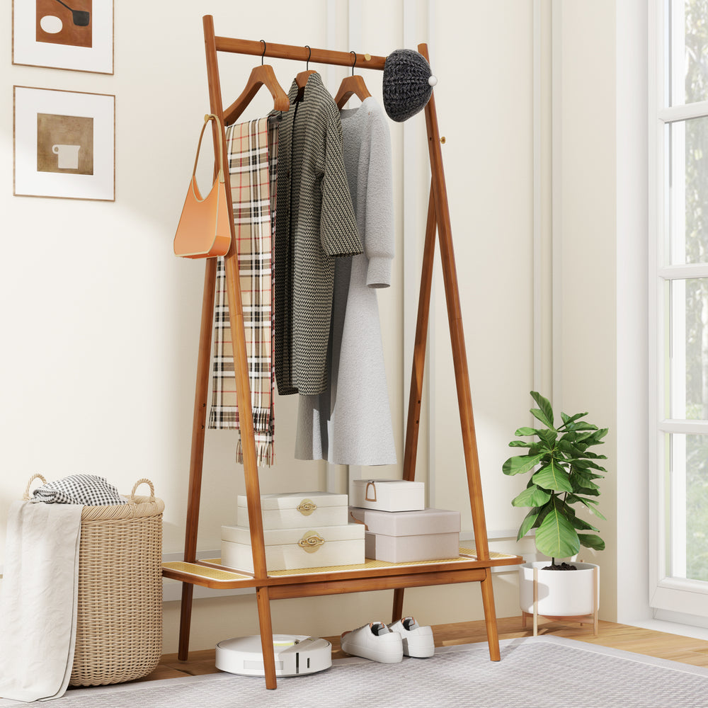 Bamboo clothes rack with hanging rod, rattan shelf, and copper hooks, ideal for organizing entryway or bedroom.