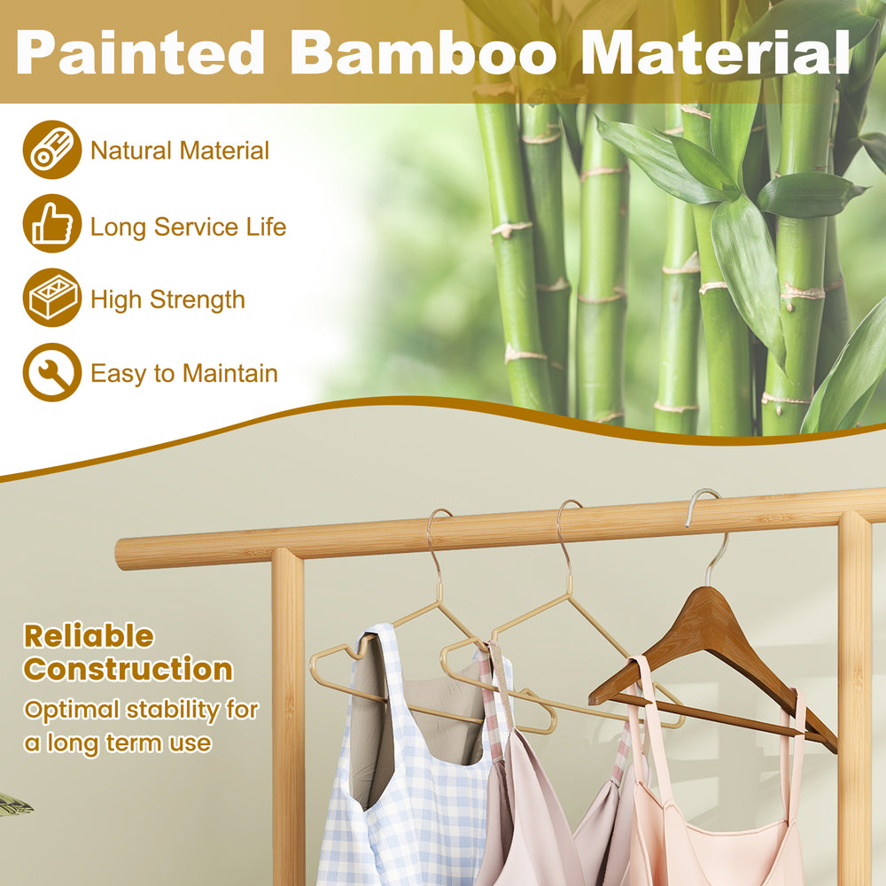 Bamboo clothes rack with hanging rod and rattan storage basket, featuring wheels for easy movement and natural style.
