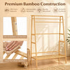 Bamboo clothing garment rack features a sturdy A-shaped frame, two shelves, and hooks for versatile storage in any room.