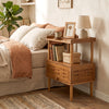 Bamboo rattan nightstand with raised edge, flip-up door, and open shelf, perfect for bedroom or living room storage.